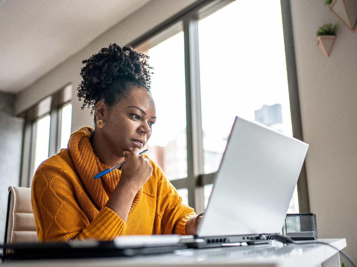 Woman looking at laptop